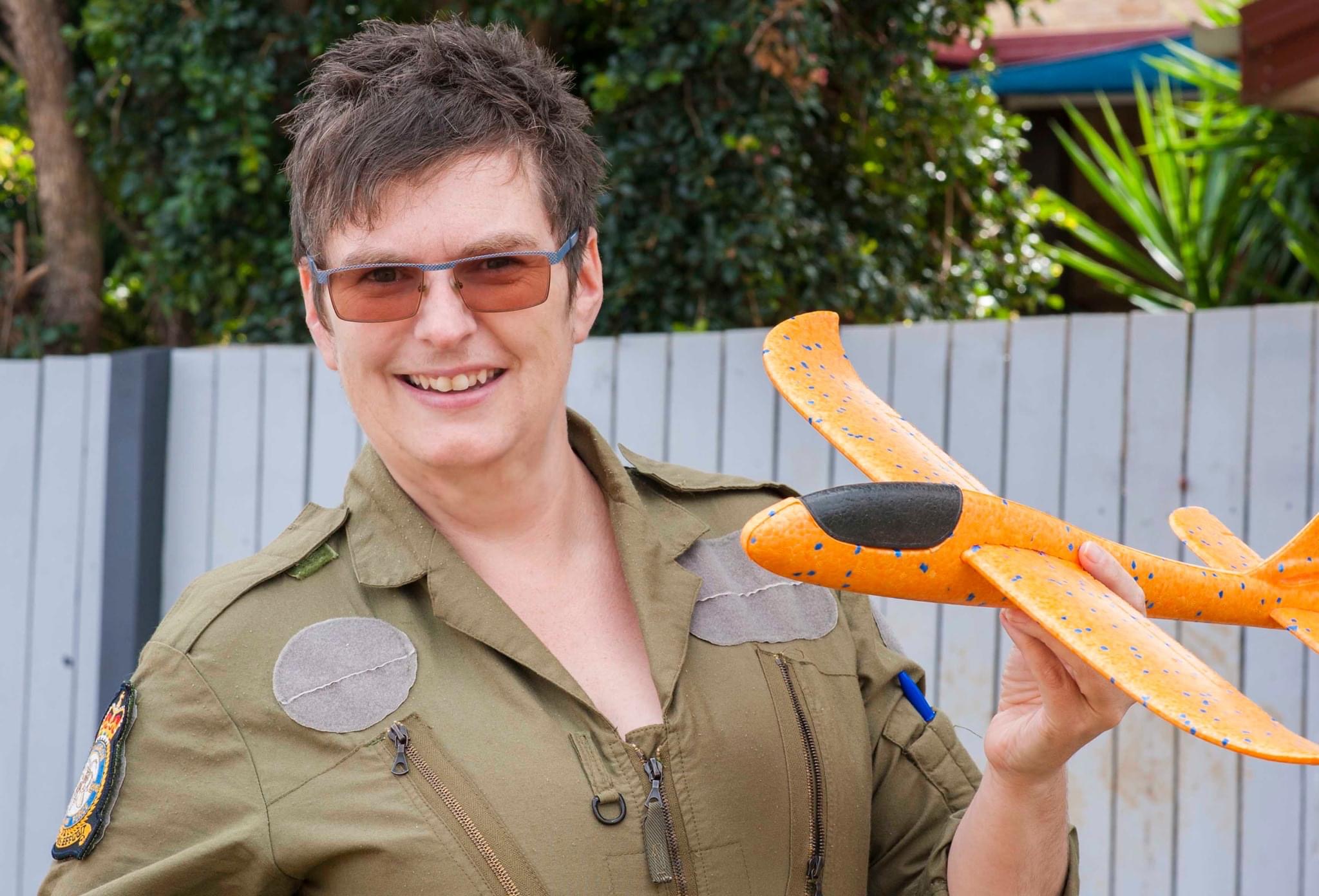 Ruth holding model plane