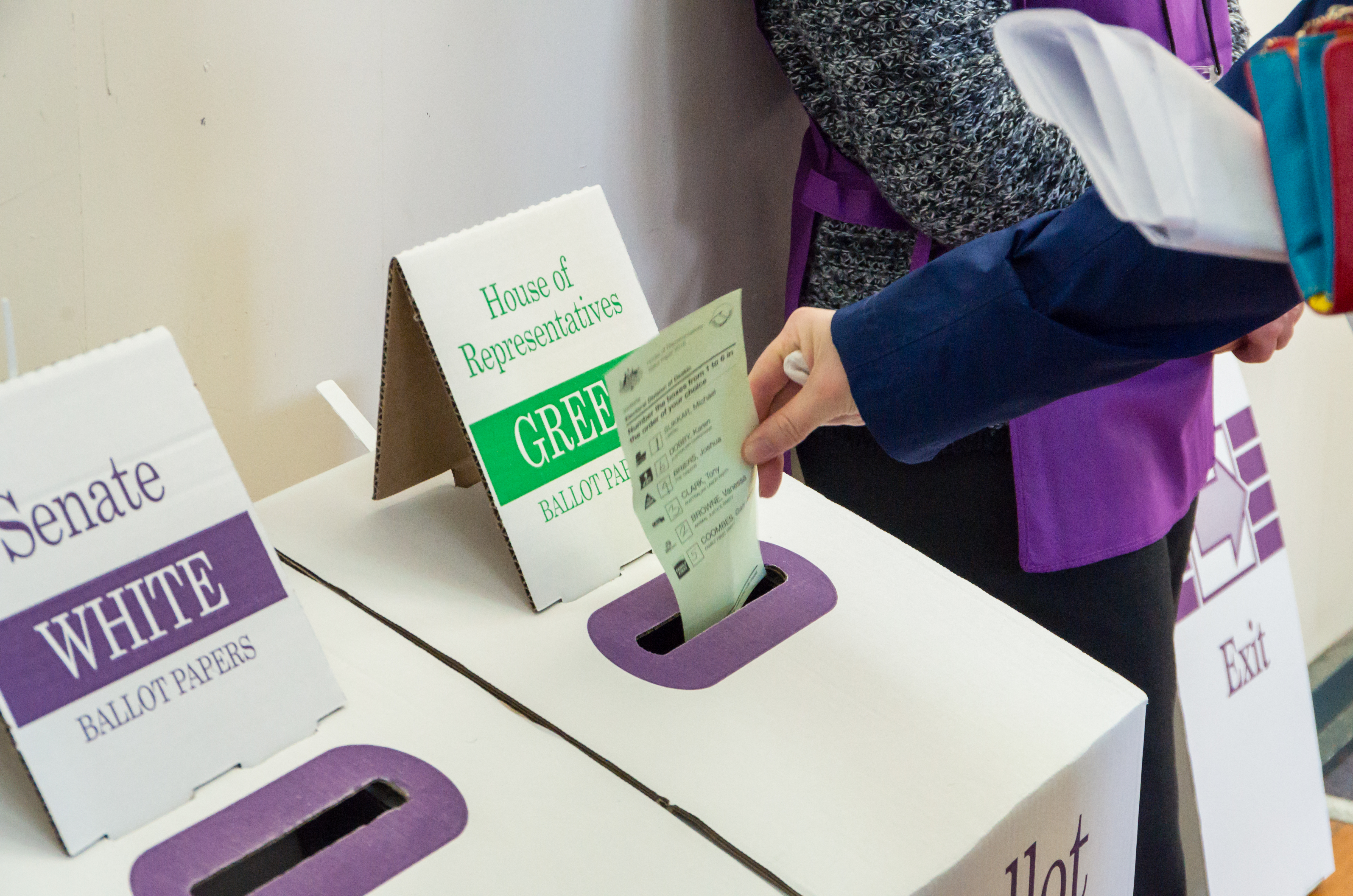 A voting paper is placed in a ballot box