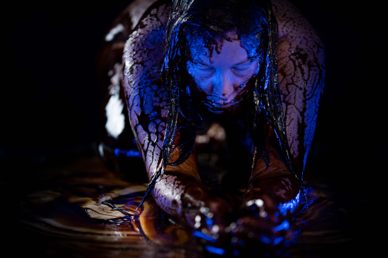 Subject Sarah King is featured covered in molasses. 