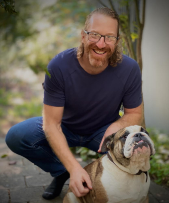 Mike Armstrong pictured with service dog, Squish.