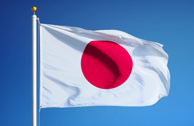 Japanese flag against blue sky background
